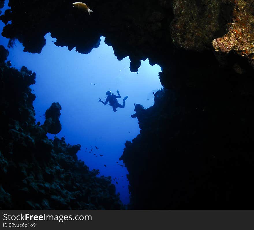 Scuba diver silhouetted in ocean. Scuba diver silhouetted in ocean