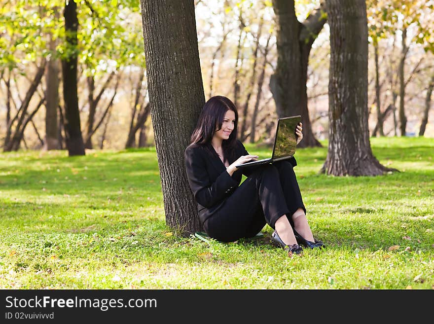 Young businesswoman working with a notebook.