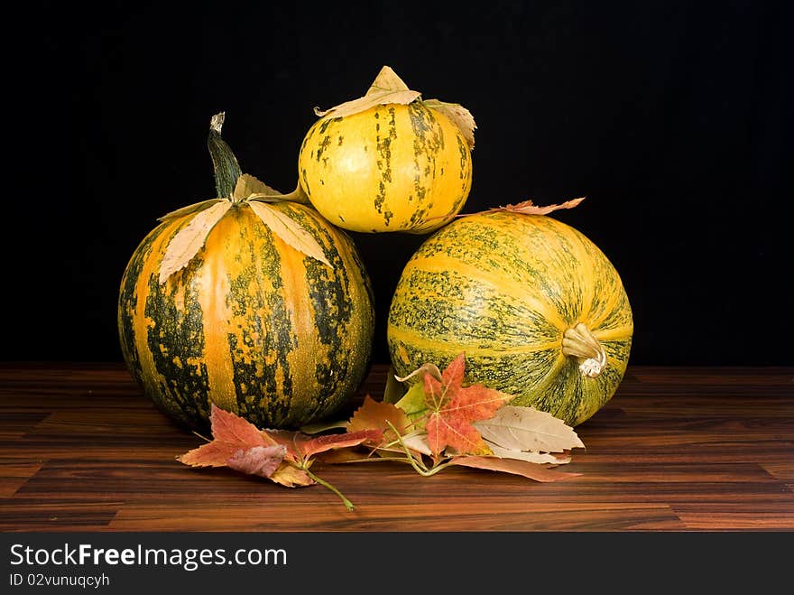 Pumpkins in black, autumn background