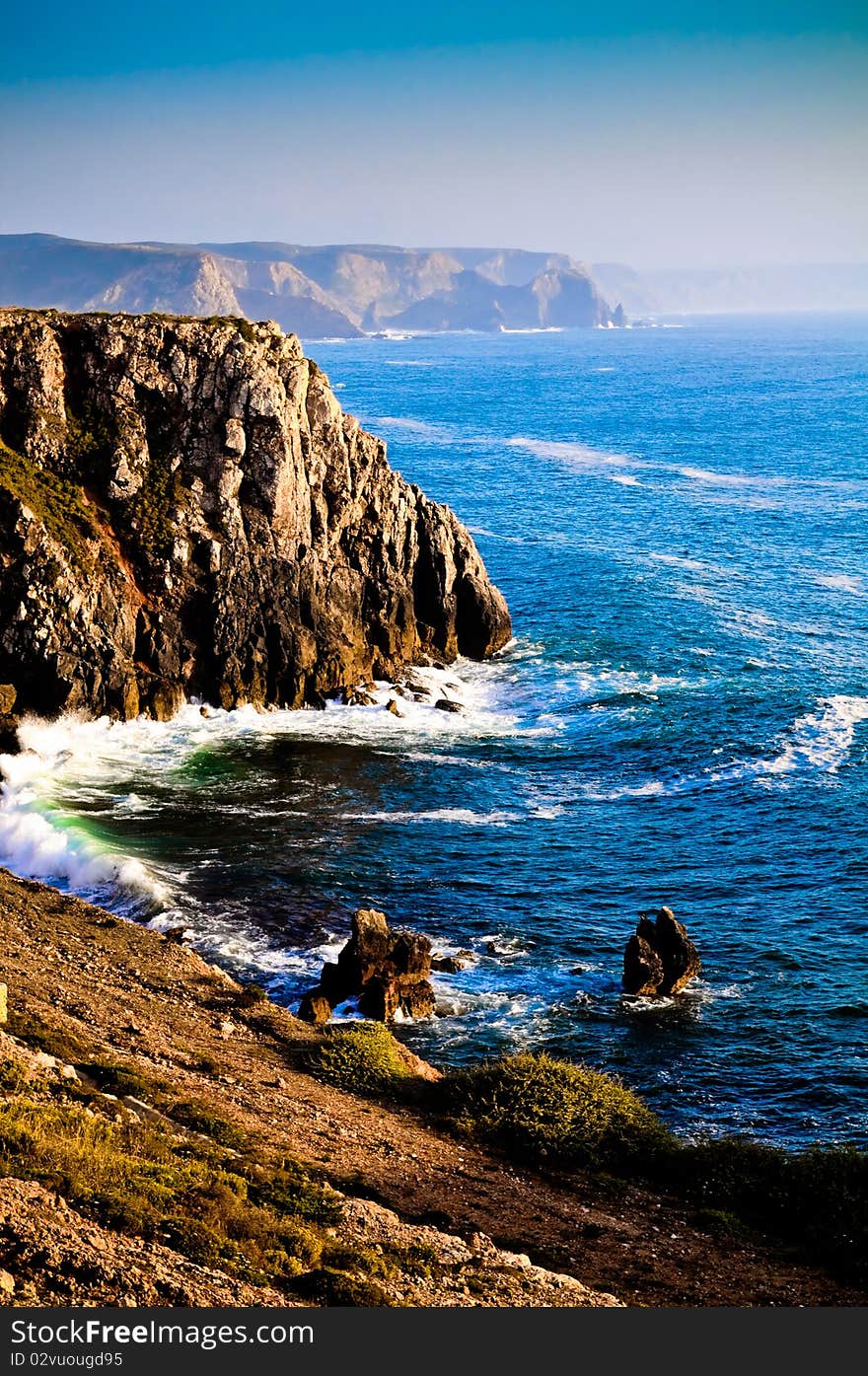 Colourful coastline view from cliff side with blue sea and sky. Colourful coastline view from cliff side with blue sea and sky