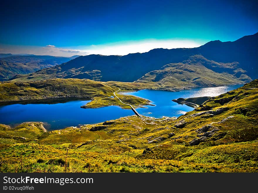 View of beautiful welsh mountain range with lake. View of beautiful welsh mountain range with lake