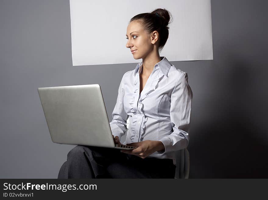 Smiley woman with laptop