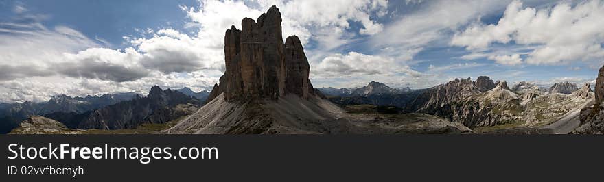 Mountain panorama in background and three summits in foreground 3 tre cime lavaredo drei zinnen. Mountain panorama in background and three summits in foreground 3 tre cime lavaredo drei zinnen