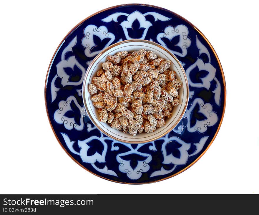 Oriental Sweets - peanuts with sesame on a plate Uzbek