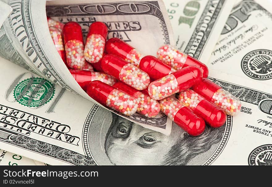 Money and red tablets closeup. Money and red tablets closeup