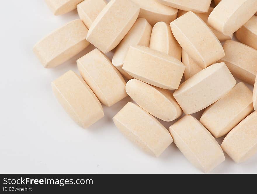 Pile of protein tablets closeup