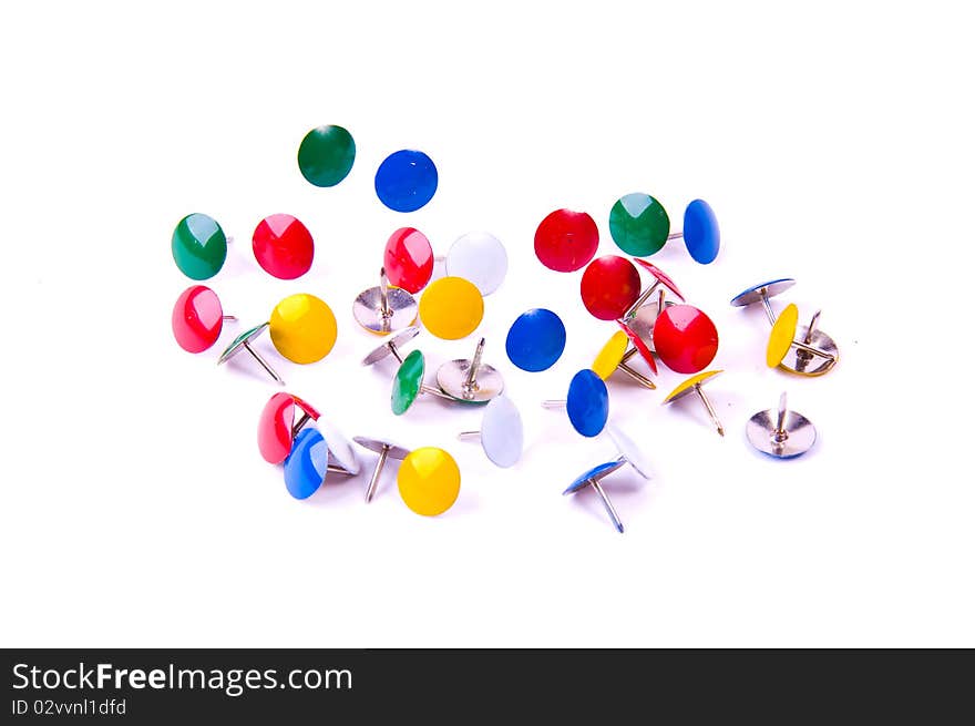 Circle of colourful office pins on white background. Circle of colourful office pins on white background