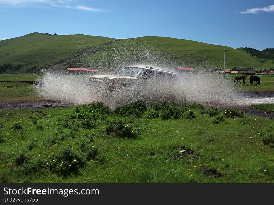 Vehicle at speed splashing out water. Vehicle at speed splashing out water