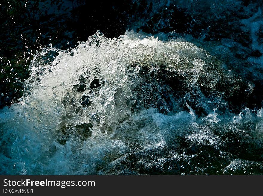 Water of a brook. By the short shutterspeed, the water seems to be frozen