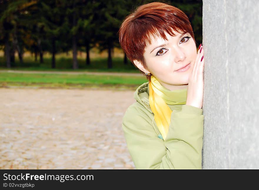 Pretty woman in the autumn park.