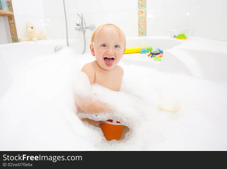 A baby girl in a bathtub