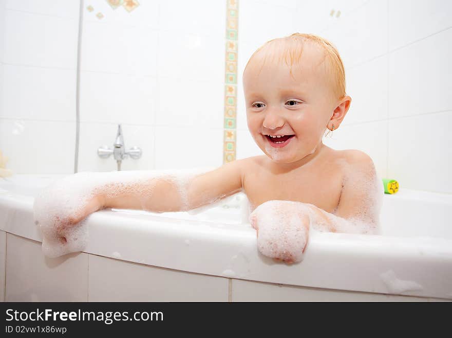 A baby girl in a bathtub