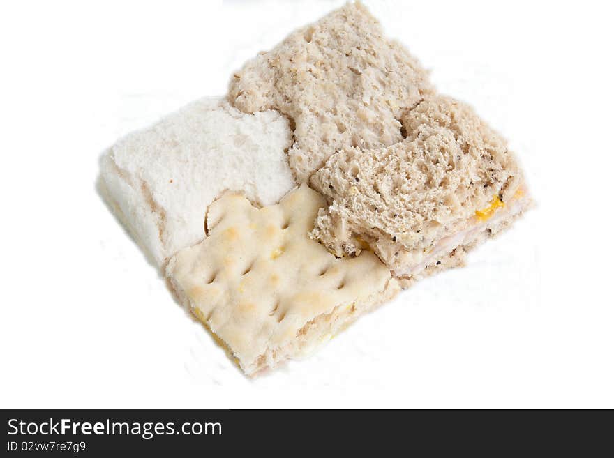 A sandwich cut into jigsaw shapes consisting of white, wholemeal, grain & swedish breads. A sandwich cut into jigsaw shapes consisting of white, wholemeal, grain & swedish breads