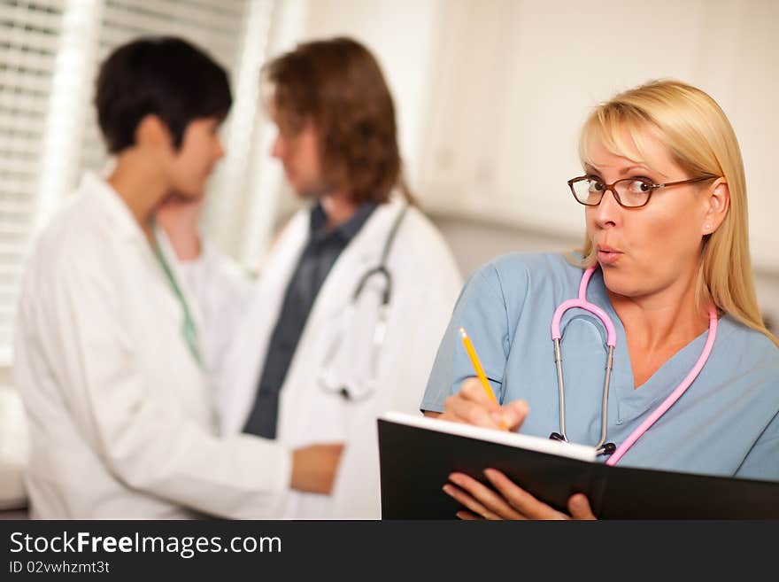 Alarmed Medical Woman Witnesses Her Colleagues Inner Office Romance Display. Alarmed Medical Woman Witnesses Her Colleagues Inner Office Romance Display.