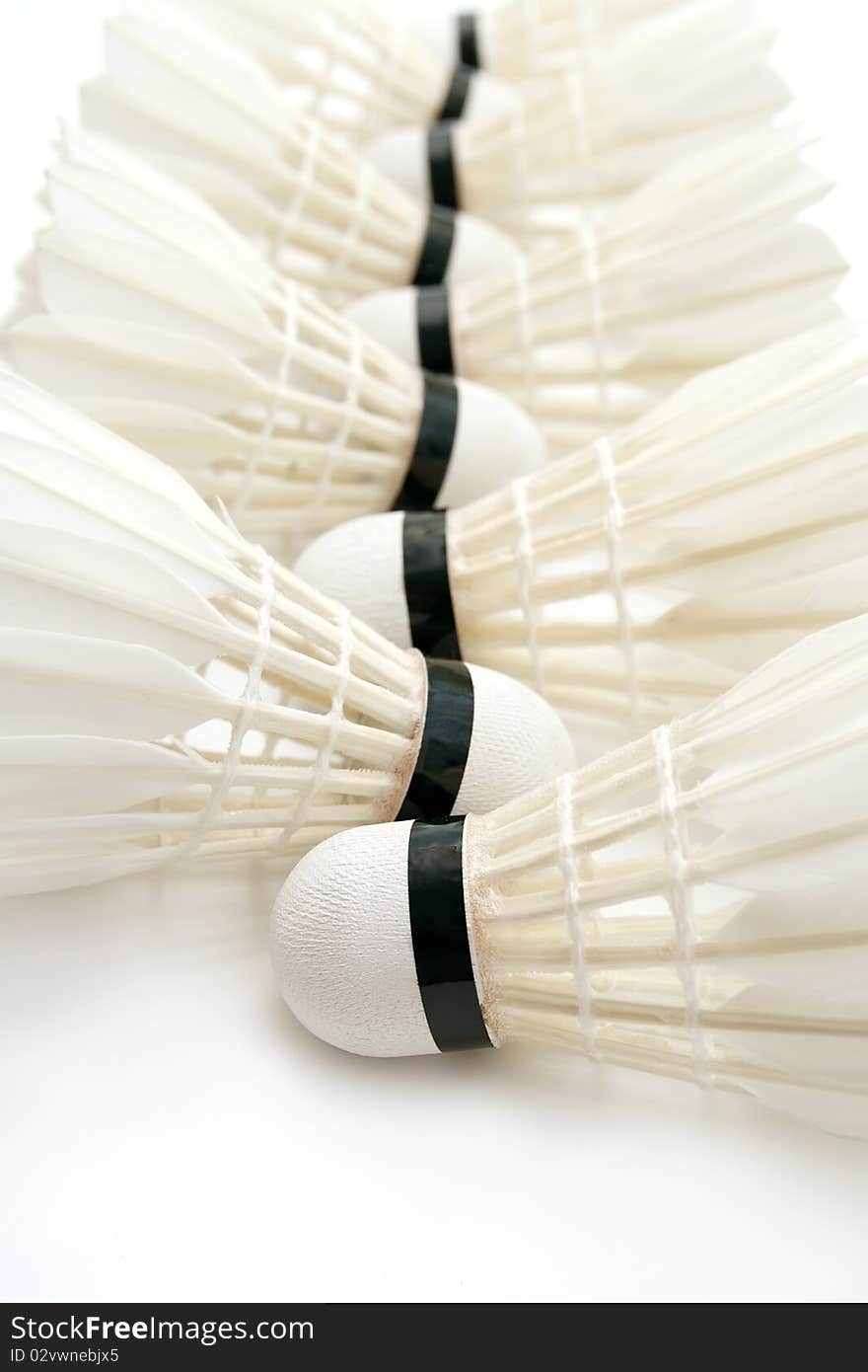 Group of white badminton shuttlecocks as a background. Group of white badminton shuttlecocks as a background