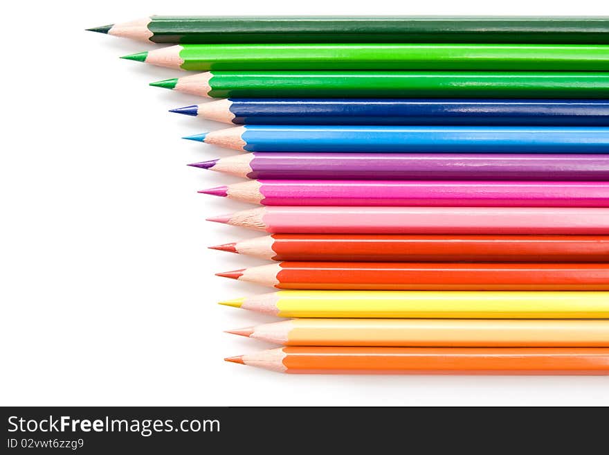 Row of bright colored pencils on white background. Row of bright colored pencils on white background