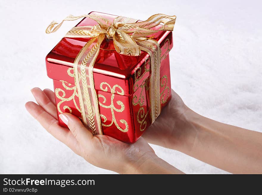 Image of small red box placed on human palm. Image of small red box placed on human palm