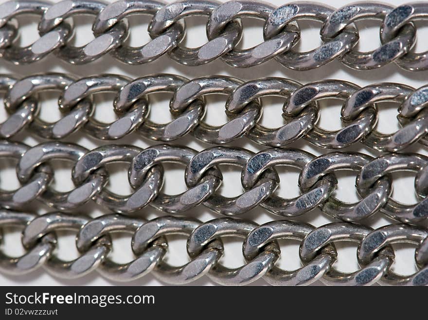 Four similar matalic chains background. Four similar matalic chains background