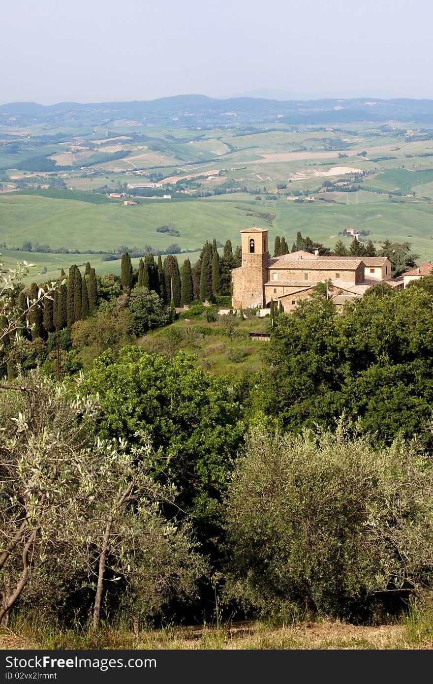 A medieval building and trees in Tuskanian hills. A medieval building and trees in Tuskanian hills