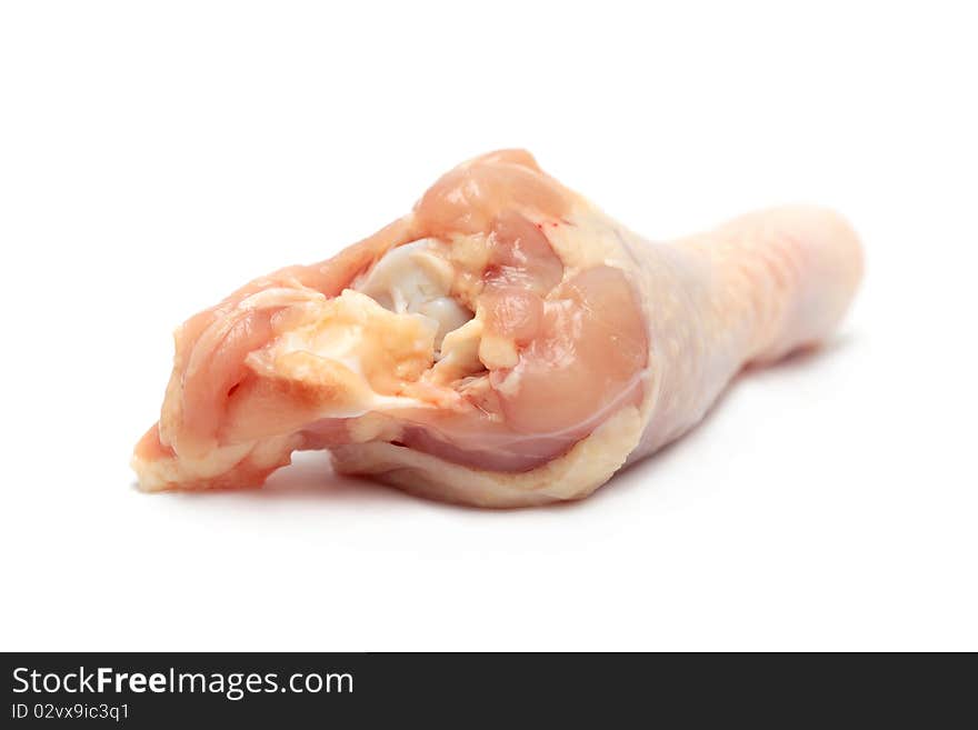 Close up of a raw chicken drumsticks isolated on white background.