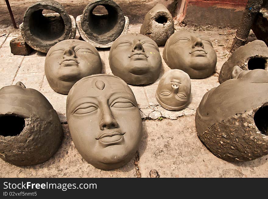 Heads of clay idols of goddess to be created are kept for drying in the sun. Heads of clay idols of goddess to be created are kept for drying in the sun.