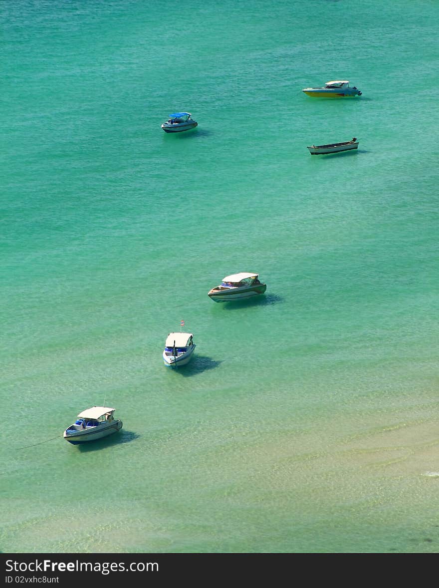 Boat parked in crystal clear waters. Boat parked in crystal clear waters.