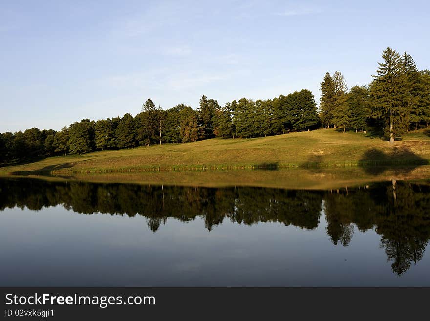 Water surfaces and trees in background. Water surfaces and trees in background