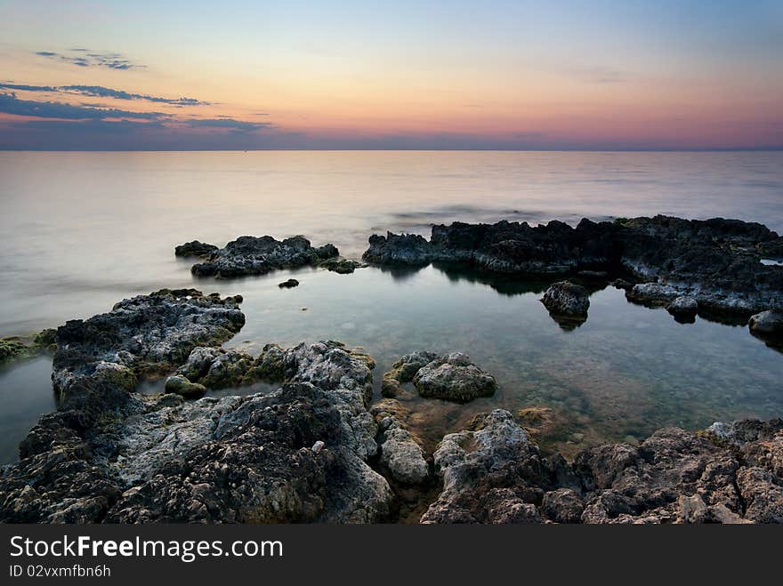 Seascape. Sunset and rocks. Nature composition.