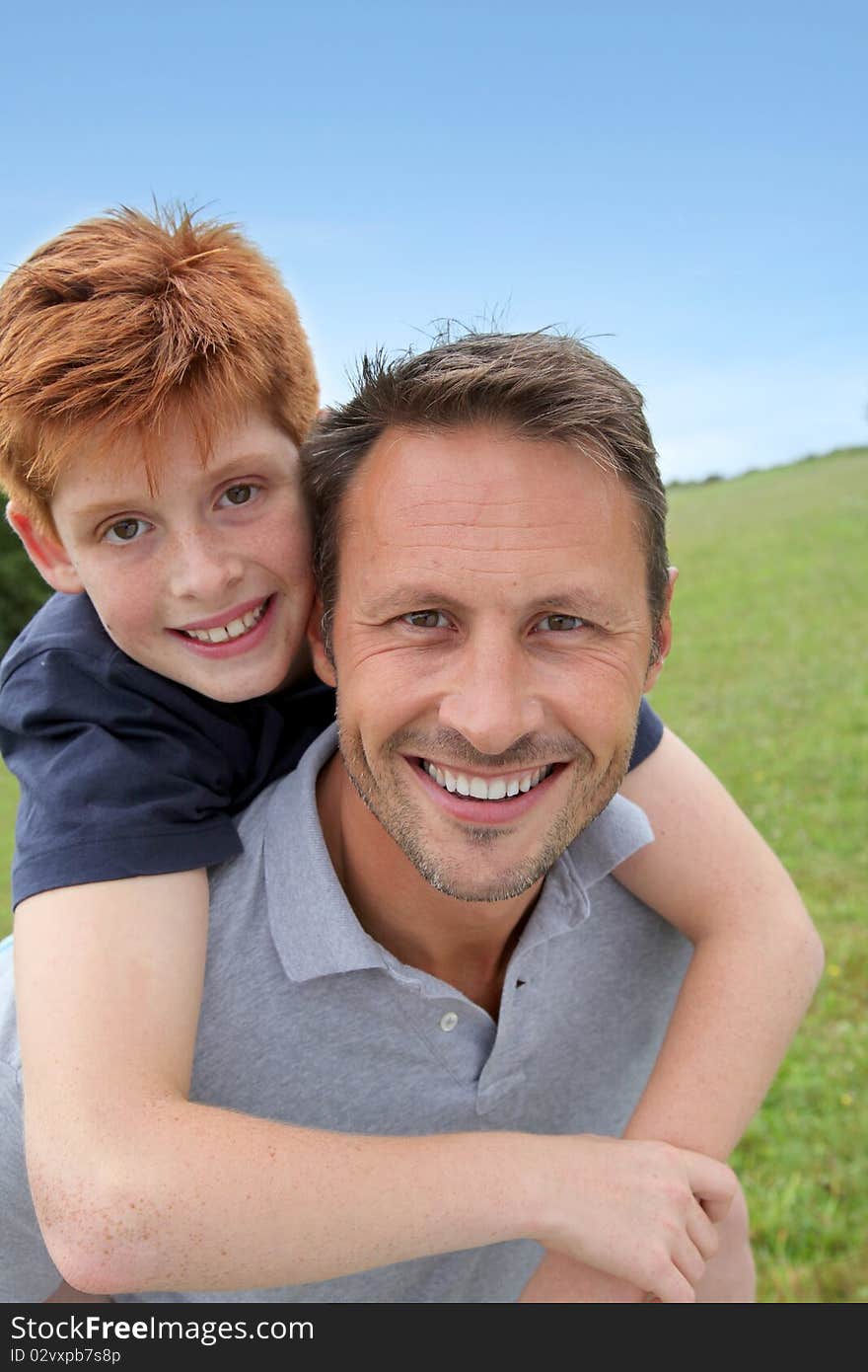 Closeup of father and son in countryside. Closeup of father and son in countryside