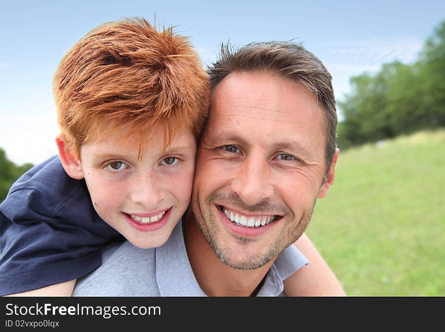 Closeup of father and son in countryside. Closeup of father and son in countryside