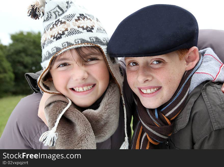 Brother and sister wearing hat in winter. Brother and sister wearing hat in winter