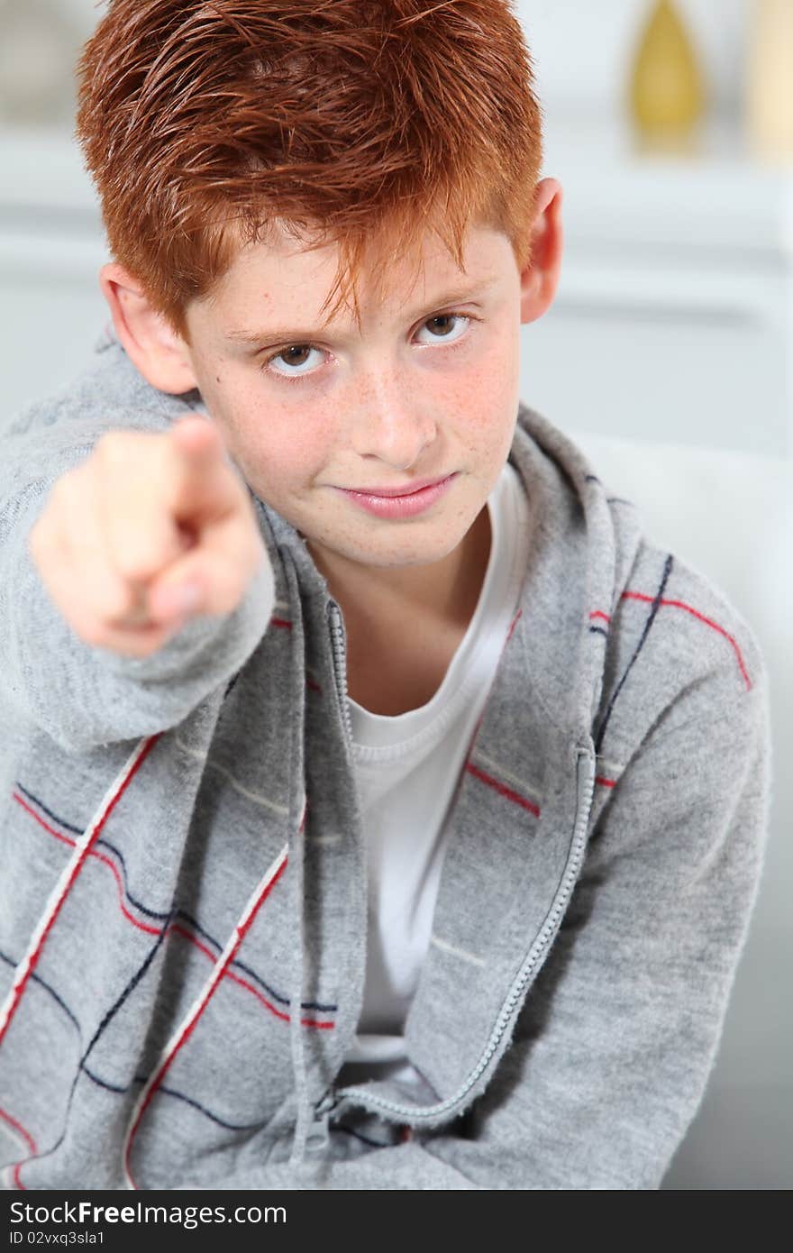 Young boy pointing at camera. Young boy pointing at camera