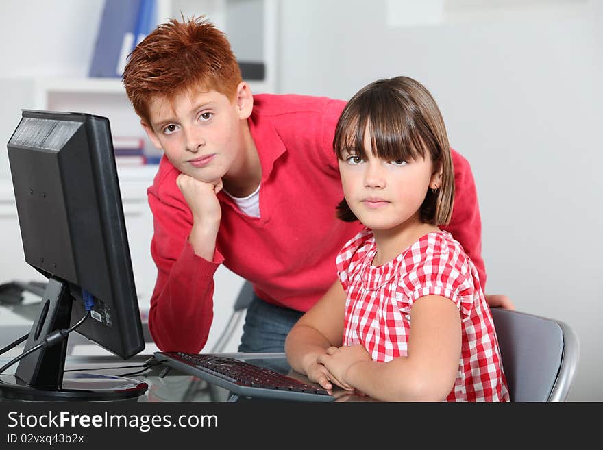 Children sitting in classroom in front of computer. Children sitting in classroom in front of computer