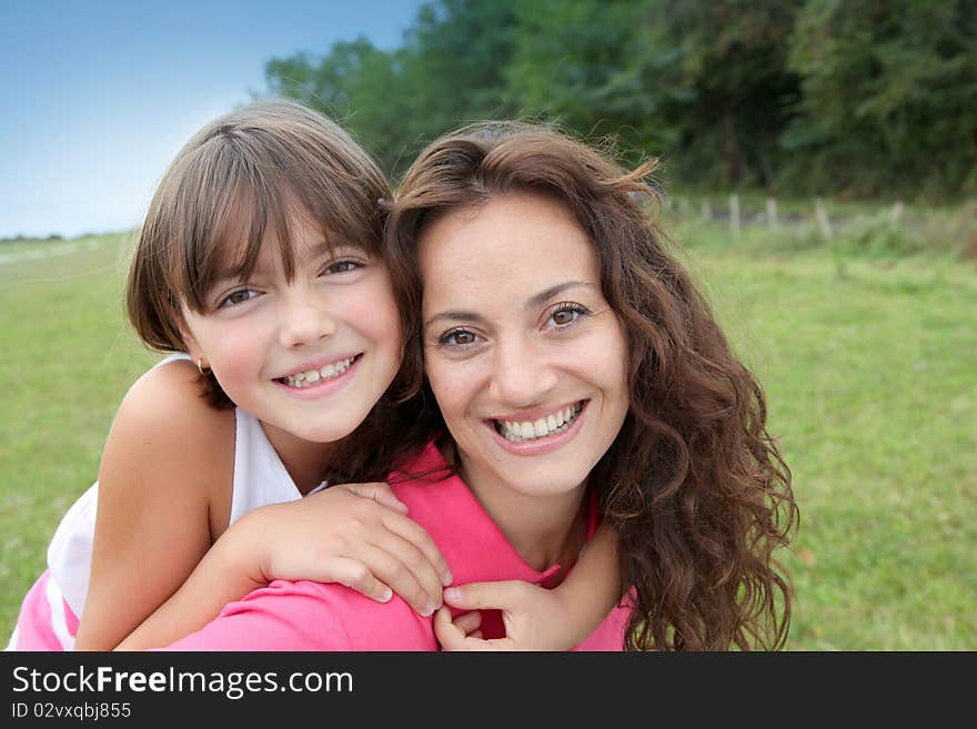 Closeup of mother and daughter in countryside. Closeup of mother and daughter in countryside