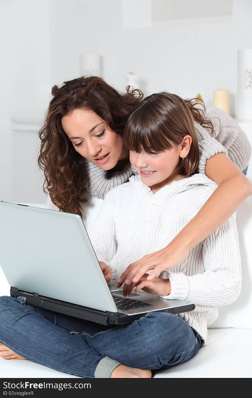 Woman And Girl In Front Of Computer