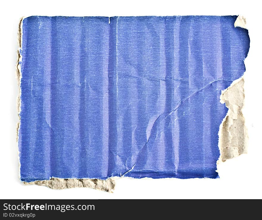 Broken pieces of cardboard boxes on a white background, macro photo