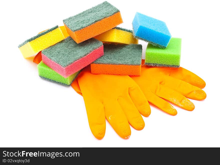 Rubber gloves and kitchen sponges on white