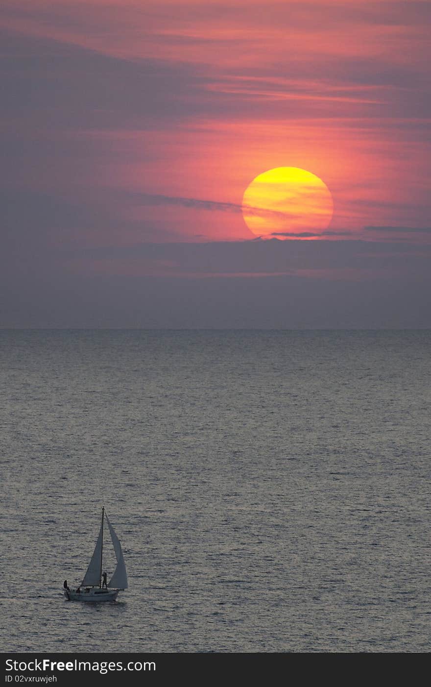 Sailing vessel going at sunset. Sailing vessel going at sunset