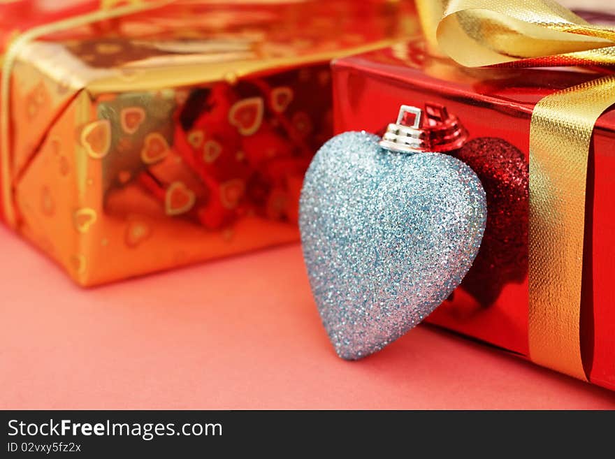 Several colored gift boxes and decorative heart