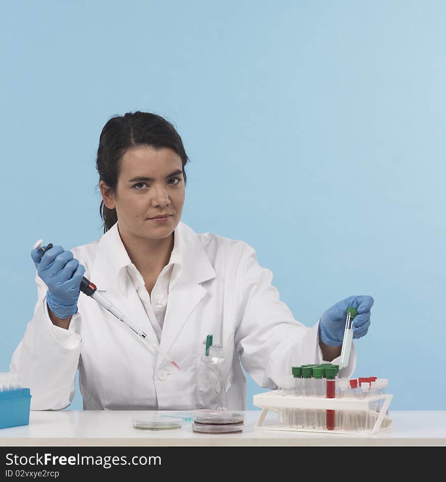 One woman scientiest sitting down while working on experiment, front view, colored background
real laboratory equipement. One woman scientiest sitting down while working on experiment, front view, colored background
real laboratory equipement