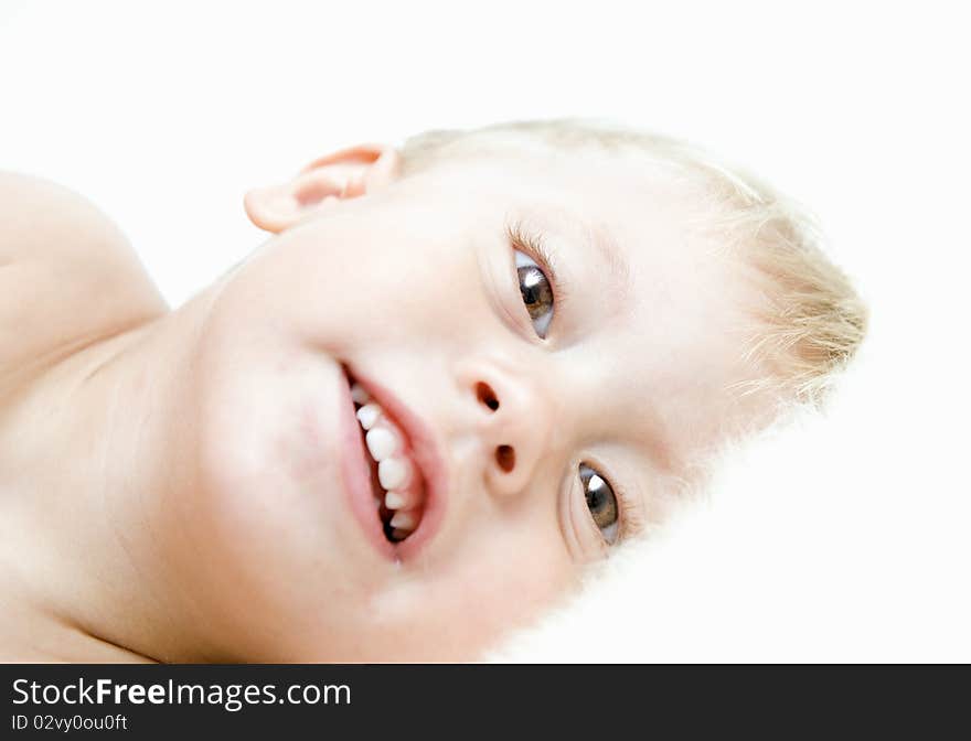 The smiling child on a white background. The smiling child on a white background