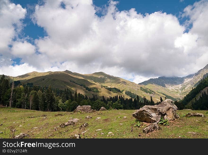 Picturesque valleys above lake Ritsa involve with the beauty and mineral sources of many tourists.Abkhazia. Picturesque valleys above lake Ritsa involve with the beauty and mineral sources of many tourists.Abkhazia.