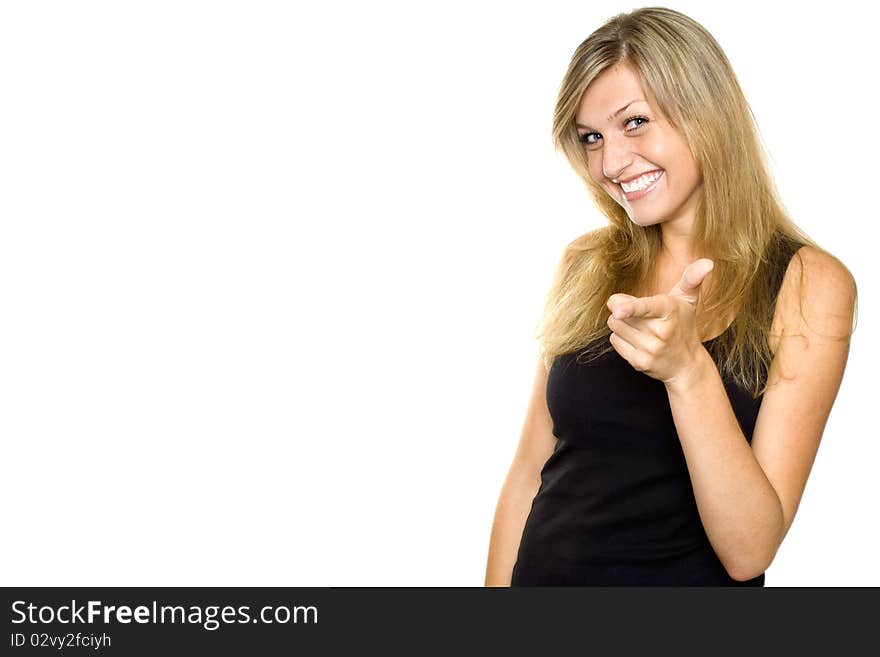 Close-up of young woman pointing at camera. Isolated on white background