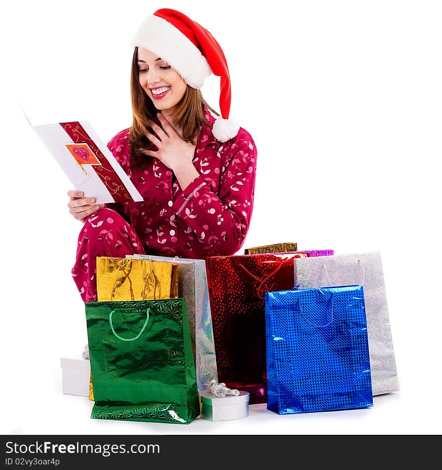 Young lady with christmas card and gifts