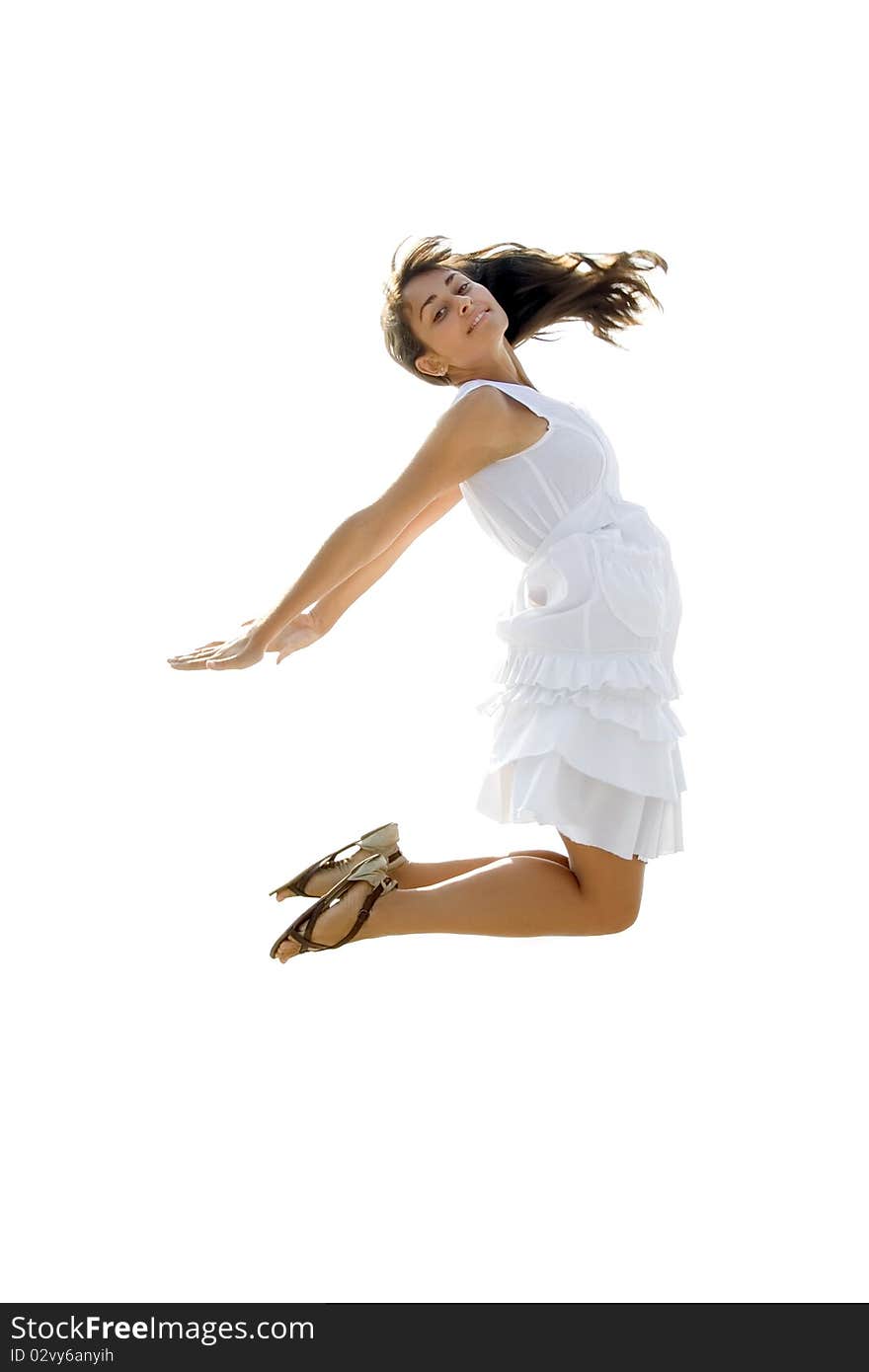 Young lady in white dress jumping. Isolated. Young lady in white dress jumping. Isolated