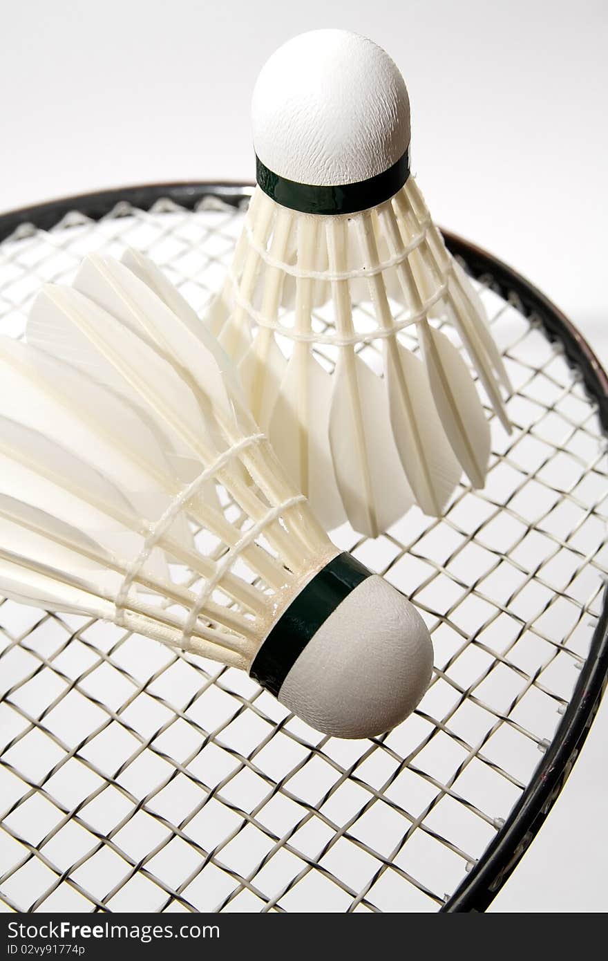 Badminton shuttlecocks on the racket