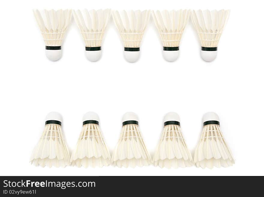 Two rows of badminton shuttlecocks on white background. Two rows of badminton shuttlecocks on white background