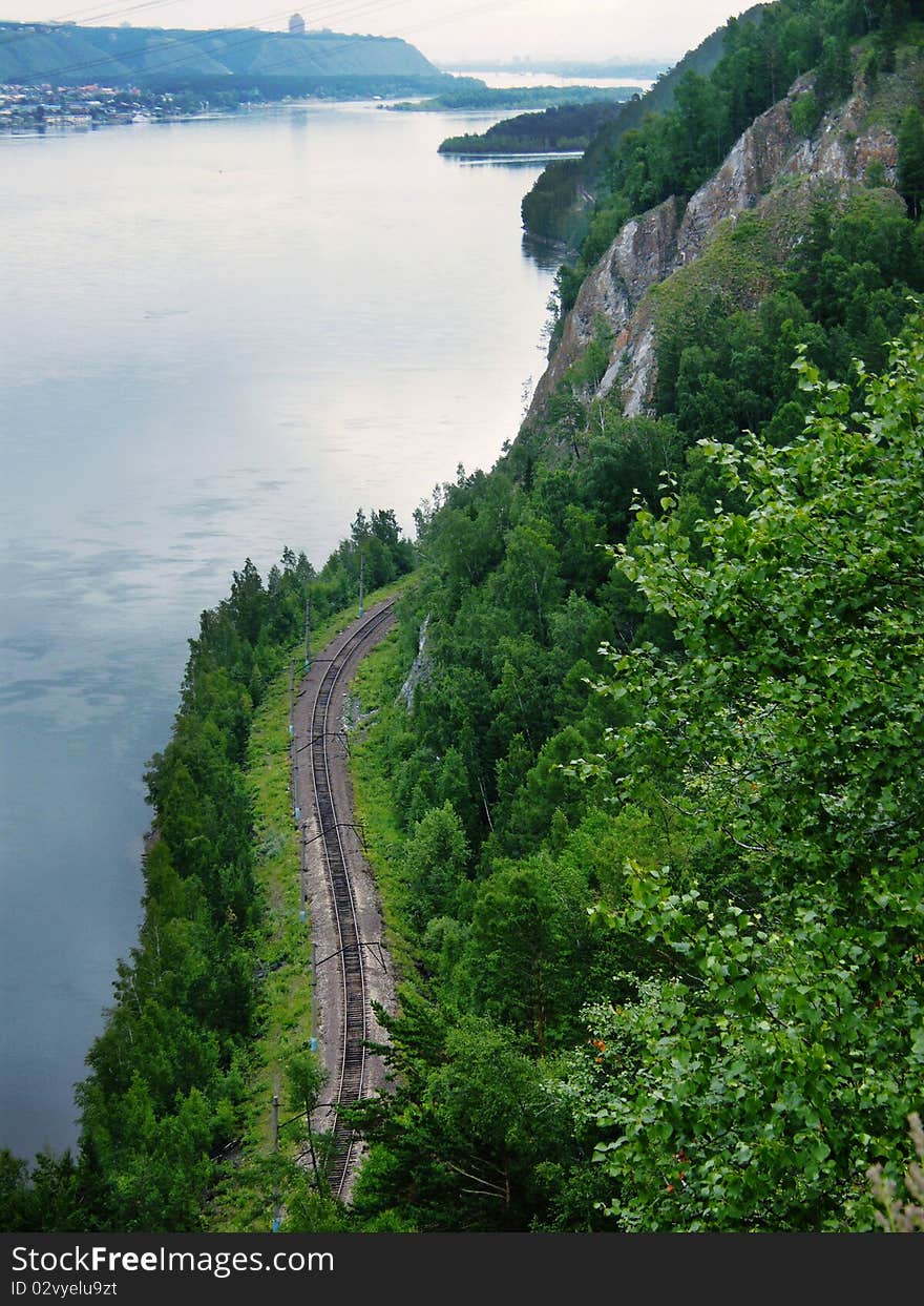 Railway runs along the river, view from above