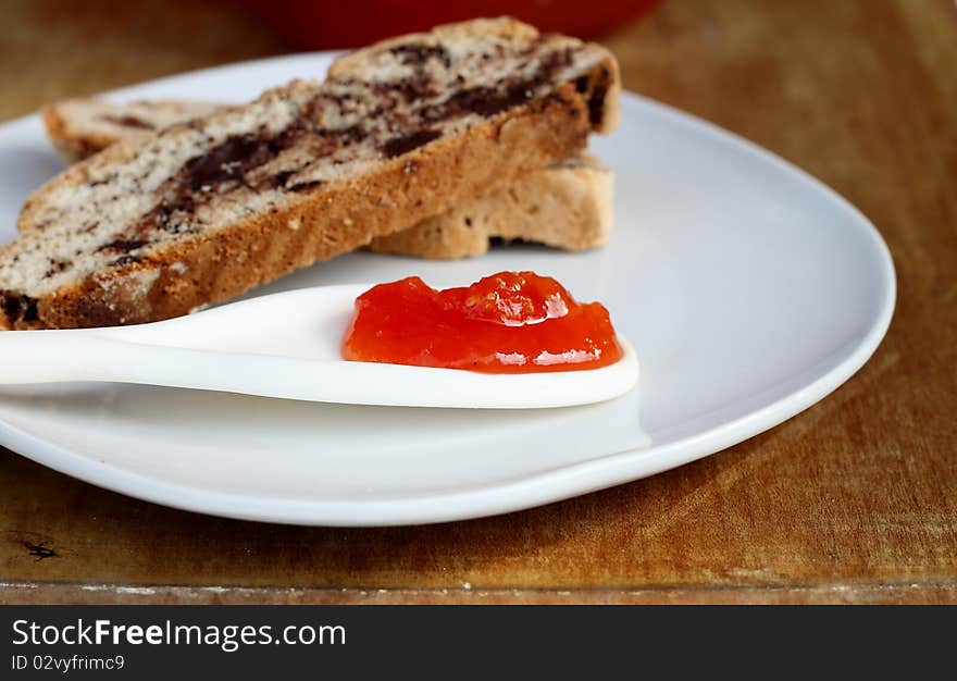 Delicious tomato jam with cinnamon with chocolate biscotti