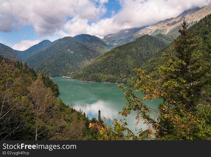 Lake Ritsa - one of the most beautiful lakes in the Caucasian mountains. The main tourist object of Abkhazia - national park, reserve. Lake Ritsa - one of the most beautiful lakes in the Caucasian mountains. The main tourist object of Abkhazia - national park, reserve.